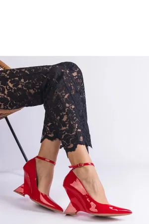 Red patent leather wedge pumps